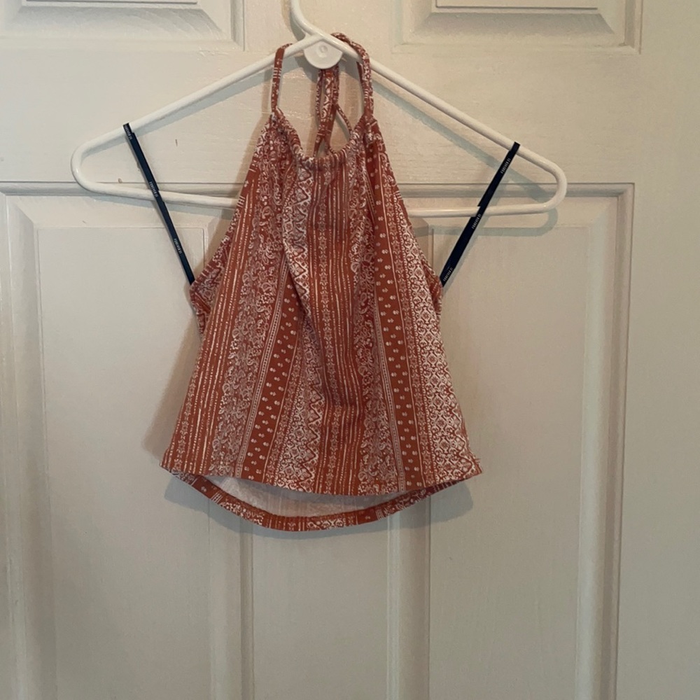 Backless halter top with orange and white patterns